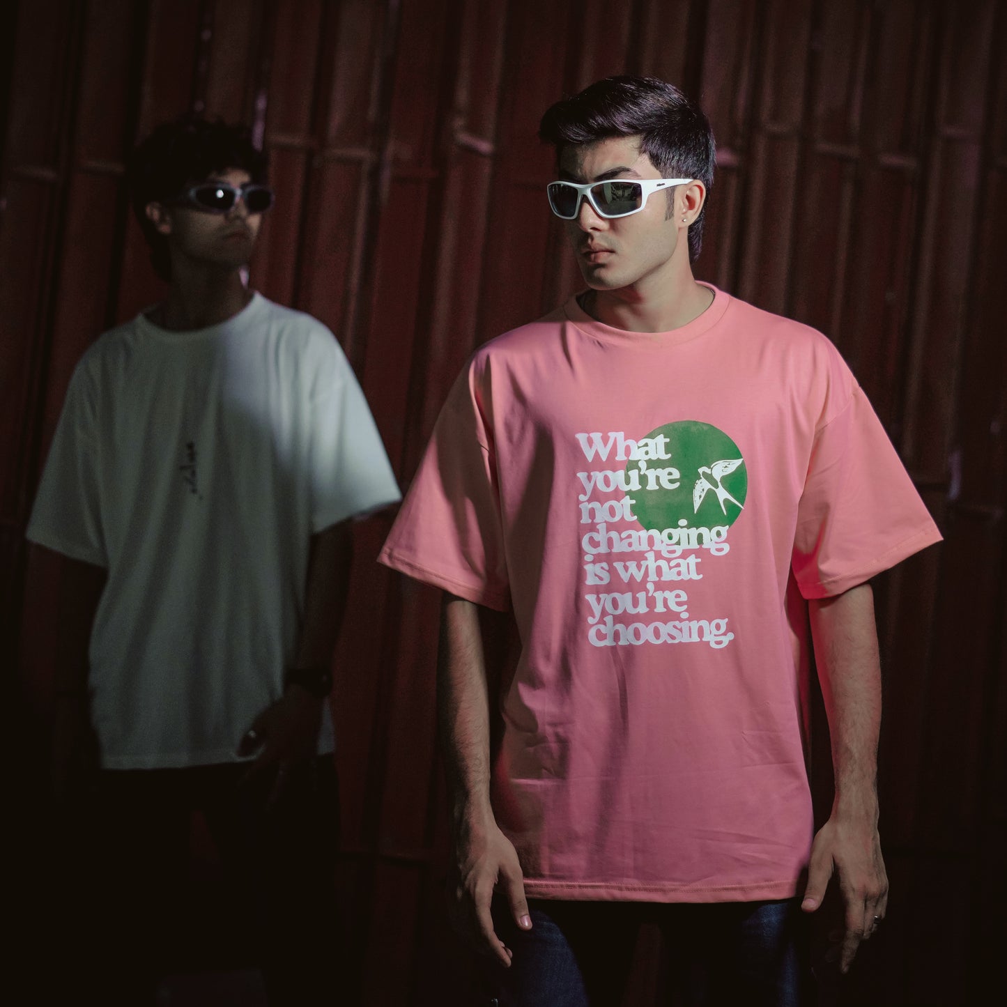 T-shirt in rose gold color featuring ‘what you’re not changing is what you’re choosing’ print