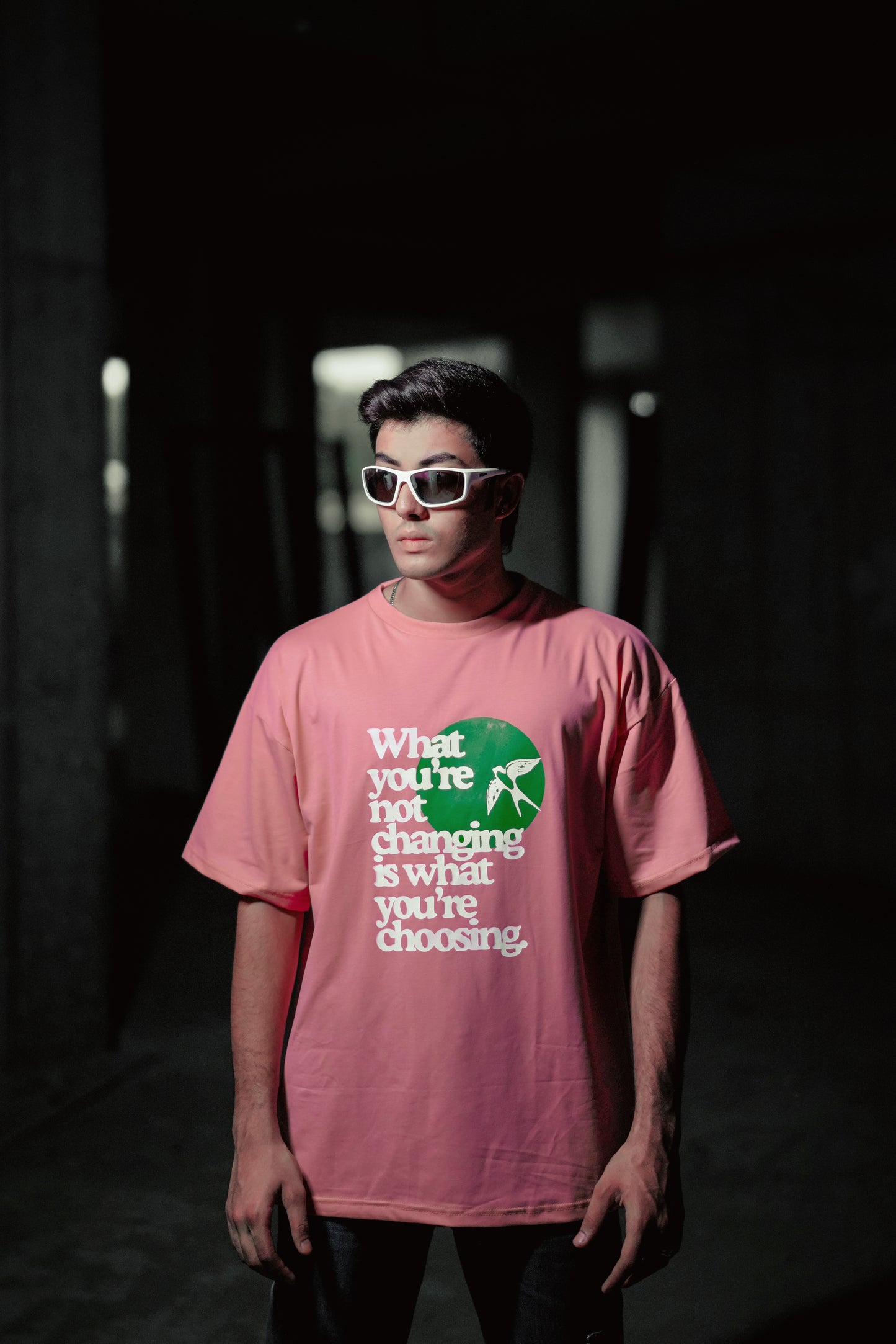 T-shirt in rose gold color featuring ‘what you’re not changing is what you’re choosing’ print