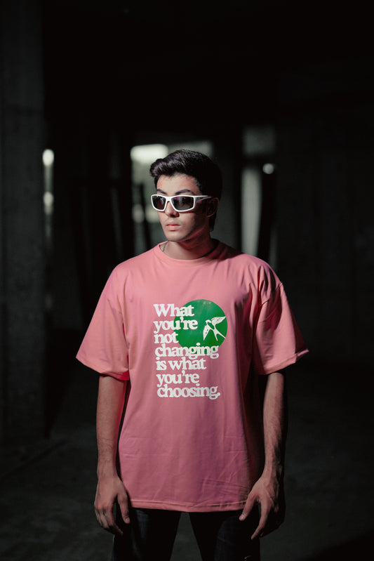 T-shirt in rose gold color featuring ‘what you’re not changing is what you’re choosing’ print